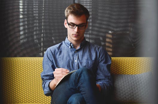 person writing in a journal