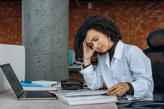 stressed professional at a desk