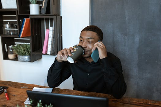 office space with plants and a cup of coffee